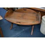 A MAHOGANY BUTLERS TRAY ON A FOLDING STAND