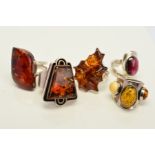 FIVE GEM SET RINGS, to include mainly various shaped modified amber cabochons, many stamped 925,