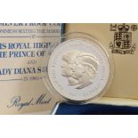 A CASED ROYAL MINT COMMEMORATIVE COIN, the Elizabeth II silver proof coin commemorating the marriage
