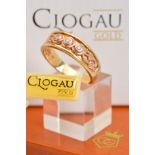 A CASED LIMITED EDITION 9CT GOLD CLOGAU TREE OF LIFE TRILOGY DIAMOND RING, designed as a tapered