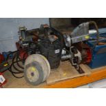 A BELT DRIVEN BENCH GRINDER on a wooden plinth together with a motor and a belt driven compressor on