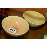 TWO RUSKIN POTTERY BOWLS, the first being a yellow and green crystalline example with impressed