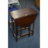 AN OAK BARLEY TWIST DROP LEAF TABLE