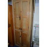 AN EDWARDIAN PINE SCHOOL CUPBOARD with two long doors over two short doors 85cm x 47cm x 231cm