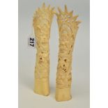 TWO CARVED BONE ORNAMENTS, the two hollowed bone pieces carved in a totem style with spiked fan