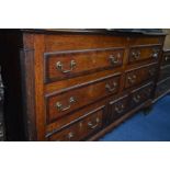 A GEORGE III OAK AND MAHOGANY BANDED LANCASHIRE MULE CHEST, the hinged top above an arrangement of