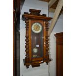 A VICTORIAN WALNUT VIENNA WALL CLOCK (winding key)