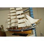 A MODEL OF THE CUTTY SARK, on stand, length 74cm x height 64cm