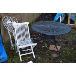 A CIRCULAR METAL GARDEN TABLE, two folding mosaic tiled garden chairs and another chair (4)