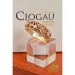 A CASED 9CT GOLD AND DIAMOND LIMITED EDITION JUBILEE CELEBRATION RING, collet set with six brilliant