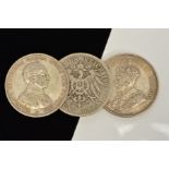 THREE CROWN SIZE SILVER COINS, to include a Cyprus 1928 45 piastres coin in E.F condition, two