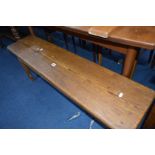 A VICTORIAN PITCH PINE BENCH, width 122cm