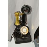 A CANDLESTICK TELEPHONE, adapted for current day use, having brass ear-piece rest and collar