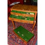 A 1930'S WALNUT THREE DRAWER CANTEEN TABLE ON CABRIOLE LEGS, the three baize lined drawers fitted