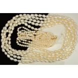 TWO FRESH WATER CULTURED PEARL NECKLACES, the first designed as a three row necklace with