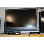 A SONY 32'' LCD TV together with a Freeview box (two remotes ) (2)