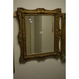 A 19TH CENTURY FOLIATE GILT WOOD BEVELLED EDGE WALL MIRROR, 59cm x 69cm (sd)