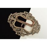 A PASTE BUCKLE, of scrolling decorative design set with circular pastes, length 95mm