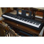 A YAMAHA P-45 DIGITAL PIANO with foot pedal, width 122cm (The contents of this lot comes from The