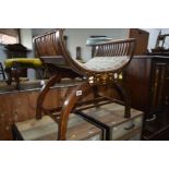 AN EDWARDIAN MAHOGANY AND INLAID CROSS FRAMED STOOL on a stretchered base