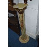 AN ONYX AND BRASS COLUMN TORCHERE STAND together with a four piece brass companion set (2)