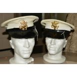 TWO U S WWII/POST WWII ERA NAVAL VISOR CAPS, white tops with black visors and trim, both have US