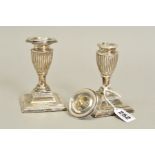 A PAIR OF LATE VICTORIAN SILVER DWARF CANDLESTICKS, detachable sconces, on stepped square loaded
