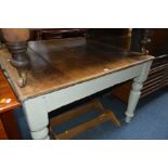 A VICTORIAN SQUARE PINE KITCHEN TABLE on a painted base, 107cm squared x height 74cm