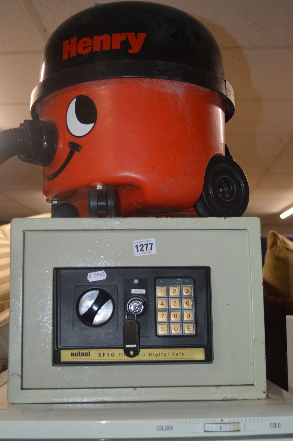 A NUTOOL SF10 ELECTRONIC DIGITAL SAFE (key), together with a Henry hoover (missing attachment) (2)