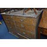 A SCUMBLED PINE CHEST OF EIGHT DRAWERS configured in two banks of four side by side all with