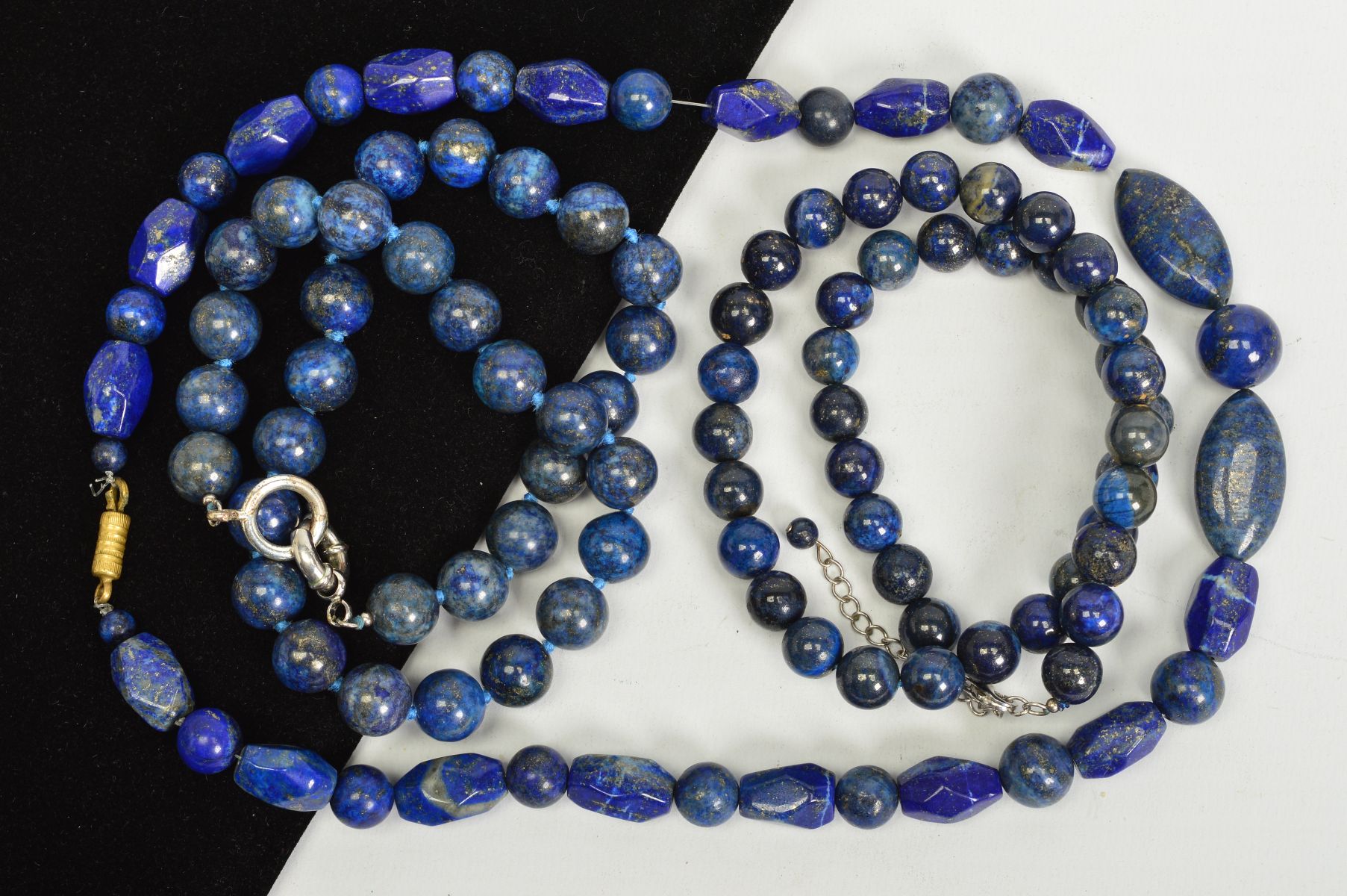 THREE LAPIS LAZULI BEAD NECKLACES, two designed as uniform spherical beads, both with spring release