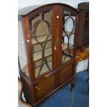 AN EDWARDIAN MAHOGANY AND FLORALLY DECORATED ASTRAGAL GLAZED DOUBLE DOOR CHINA CABINET above