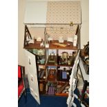 A VICTORIAN FOUR STOREY TOWN HOUSE DOLLS HOUSE, to include furniture, fittings and furnishings,