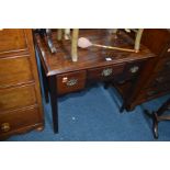 A GEORGIAN MAHOGANY LOWBOY with two deep drawers flanking a short central drawer with a shaped apron