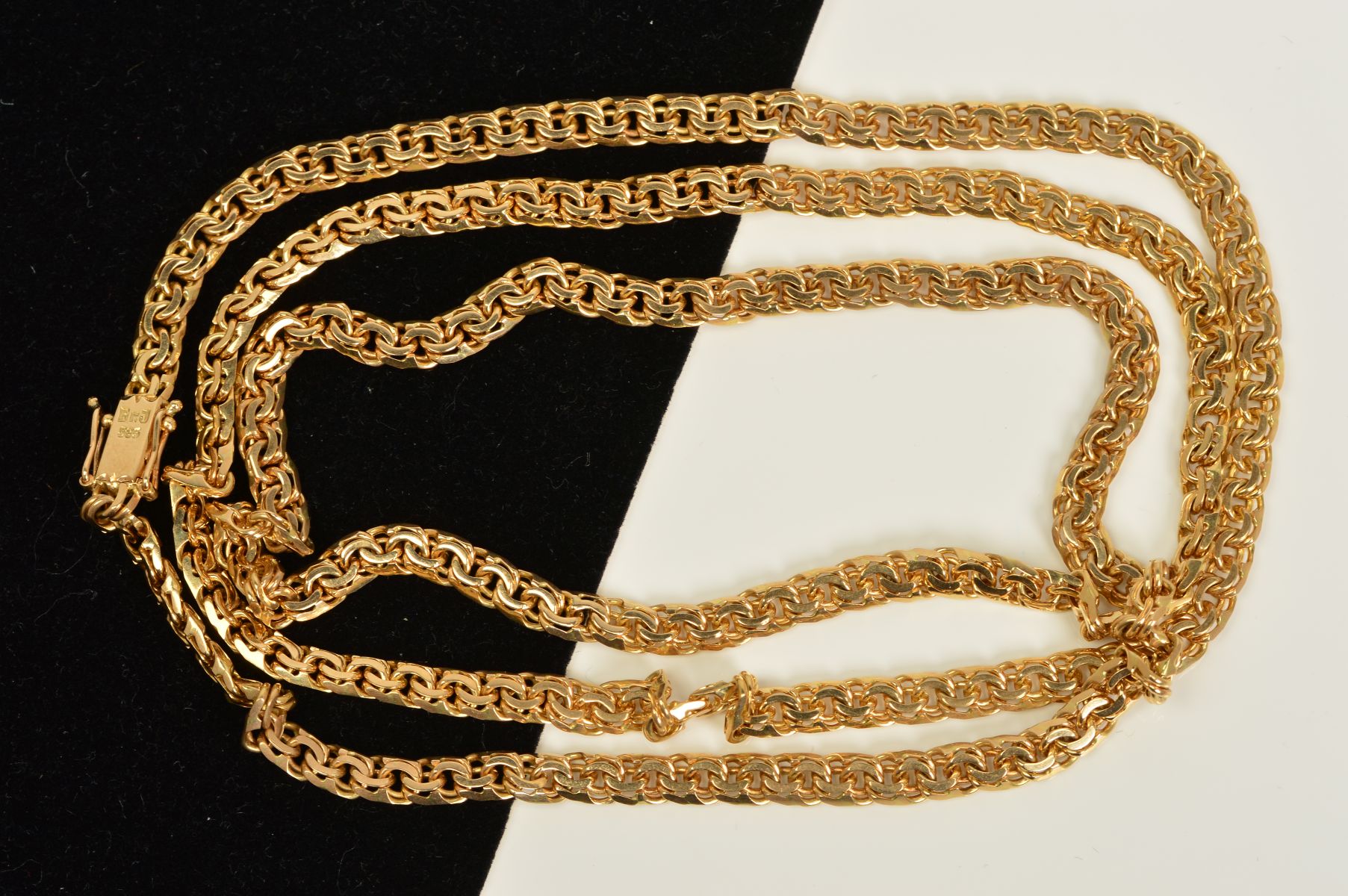 A CHAIN, the fancy curb link chain with a push piece clasp, stamped 585, length 750mm, approximate