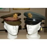 TWO US WWII ERA/POST WWII GREEN VISOR CAPS, both with gold coloured metal US insignia badge