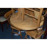 A PINE CIRCULAR KITCHEN TABLE and four chairs (5)