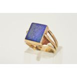 A LAPIS LAZULI SIGNET RING, designed as a rectangular lapis lazuli panel within a collet setting