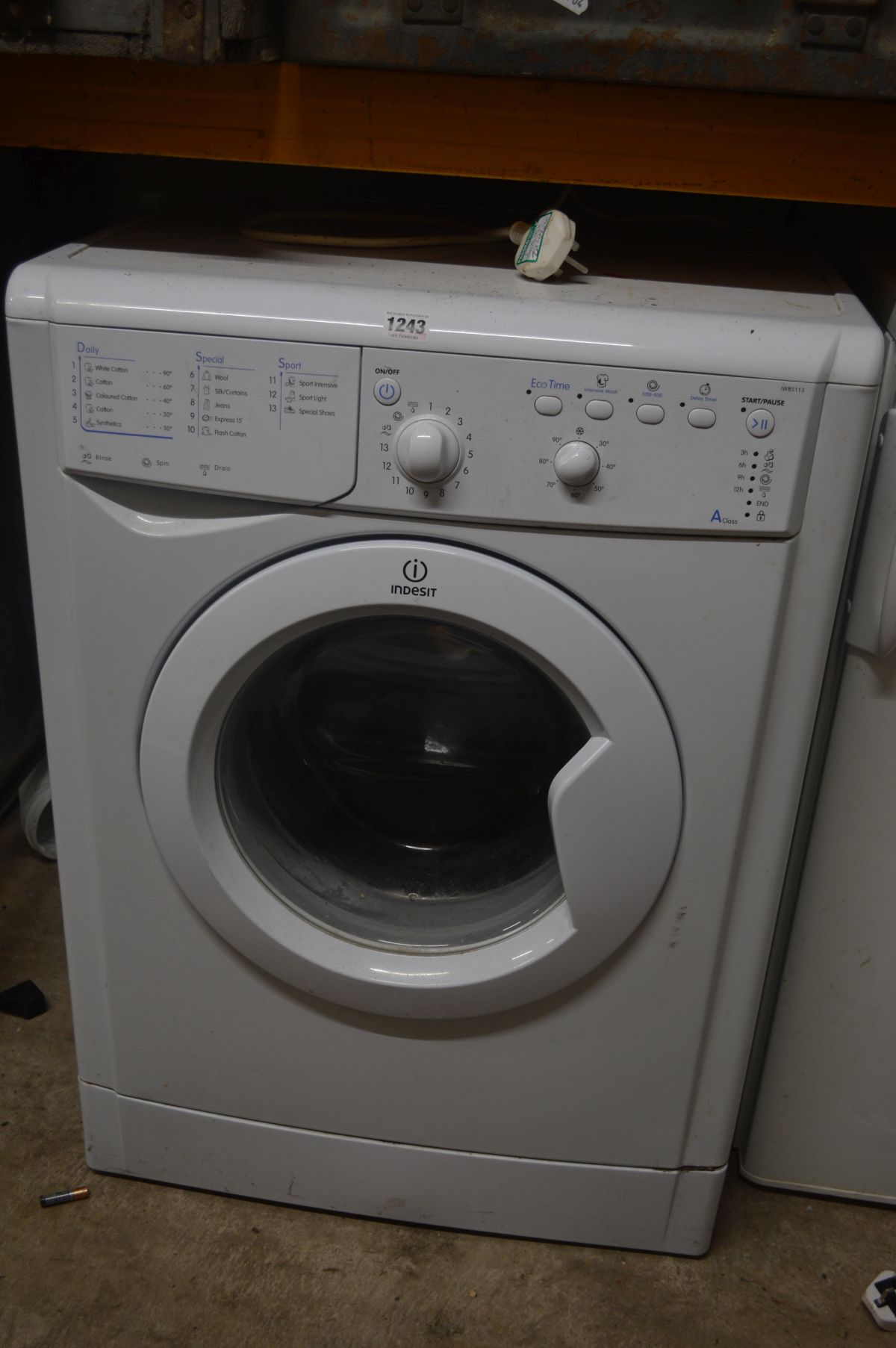 AN INDESIT WASHING MACHINE