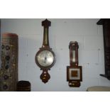 AN EARLY 19TH CENTURY ROSEWOOD BANJO BAROMETER (losses), together with an oak aneroid barometer (2)