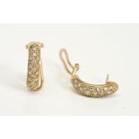 A PAIR OF 9CT GOLD DIAMOND SET EARRINGS, each designed as half hoop earrings set with three rows