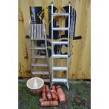 A SET LOF ALUMINIUM STEP LADDERS, together with a set of wooden step ladders, a glazed brown