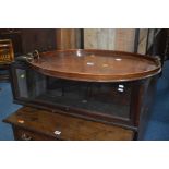 AN EDWARDIAN MAHOGANY OVAL TRAY with twin brass handles (sd), together with a single section