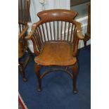 AN GEORGIAN AND LATER MAHOGANY AND WALNUT SMOKERS CHAIR, with a stick back, scrolled arms on