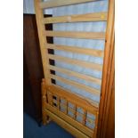 A PINE SINGLE BED FRAME and mattress