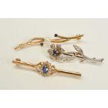 TWO GOLD BROOCHES AND ONE FURTHER BROOCH, the bar brooch with a central oval cut sapphire and