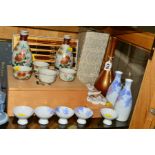 A GROUP OF BOXED MODERN ORIENTAL ITEMS, to include metal vase, height 24.5cm, sake sets, chopsticks,