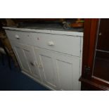 A PAINTED PINE SIDEBOARD with two drawers over two cupboard doors