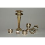 A SMALL PARCEL OF HALLMARKED SILVER, comprising five various circular napkin rings, an egg cup and