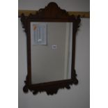 A GEORGE III STYLE MAHOGANY FRETWORK WALL MIRROR 48cm x 72cm together with another wall mirror (2)